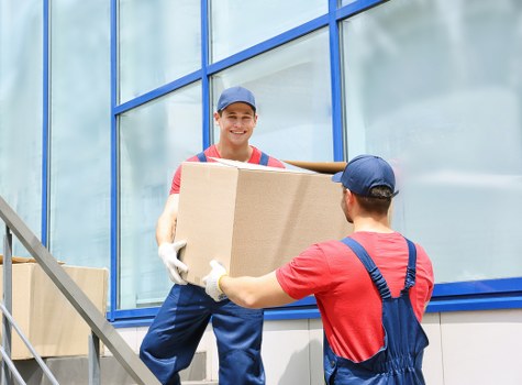 Moving home service in Notting Hill with boxes and a removal van