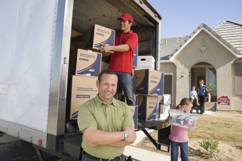 Packing supplies and labelled moving boxes in a Notting Hill home