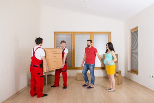 Staff reviewing a risk assessment checklist before a house move