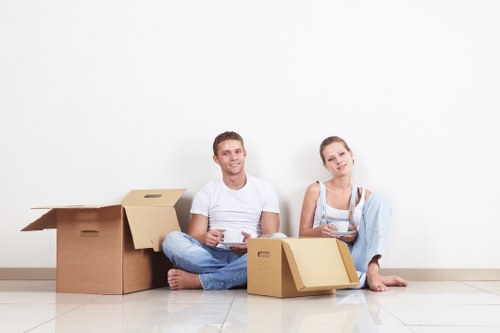 Professional movers handling packed items in a Notting Hill flat