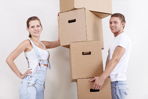 Mover using protective coverings while carrying furniture indoors