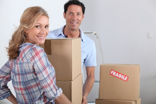 Moving crew handling business items in a Notting Hill property