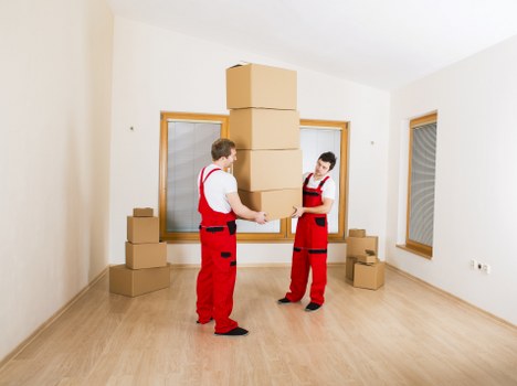Professional removals team loading furniture for a Notting Hill house move