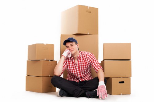 A moving team preparing boxes for transport in West London